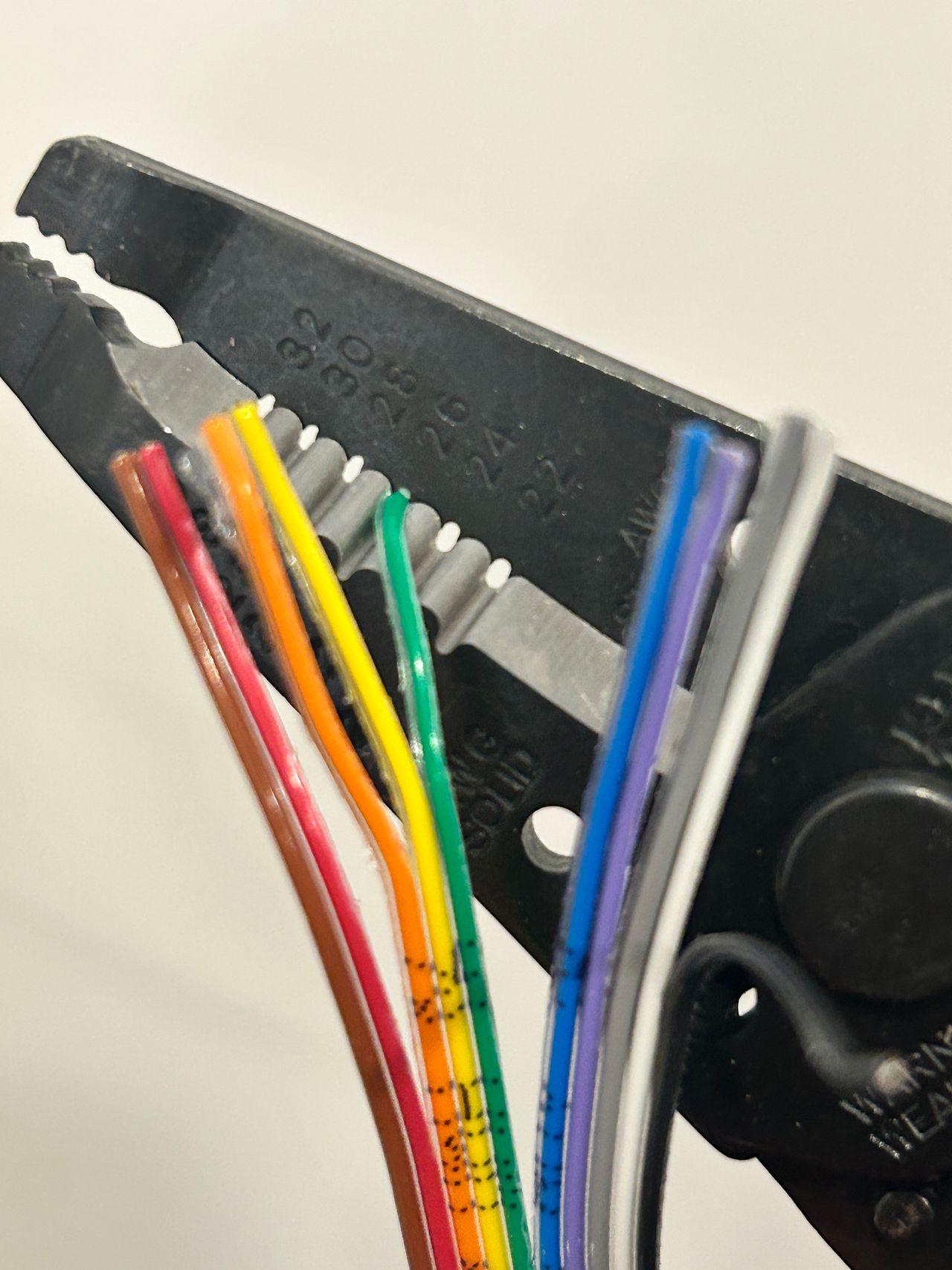 26 AWG wire stripper on ribbon cable