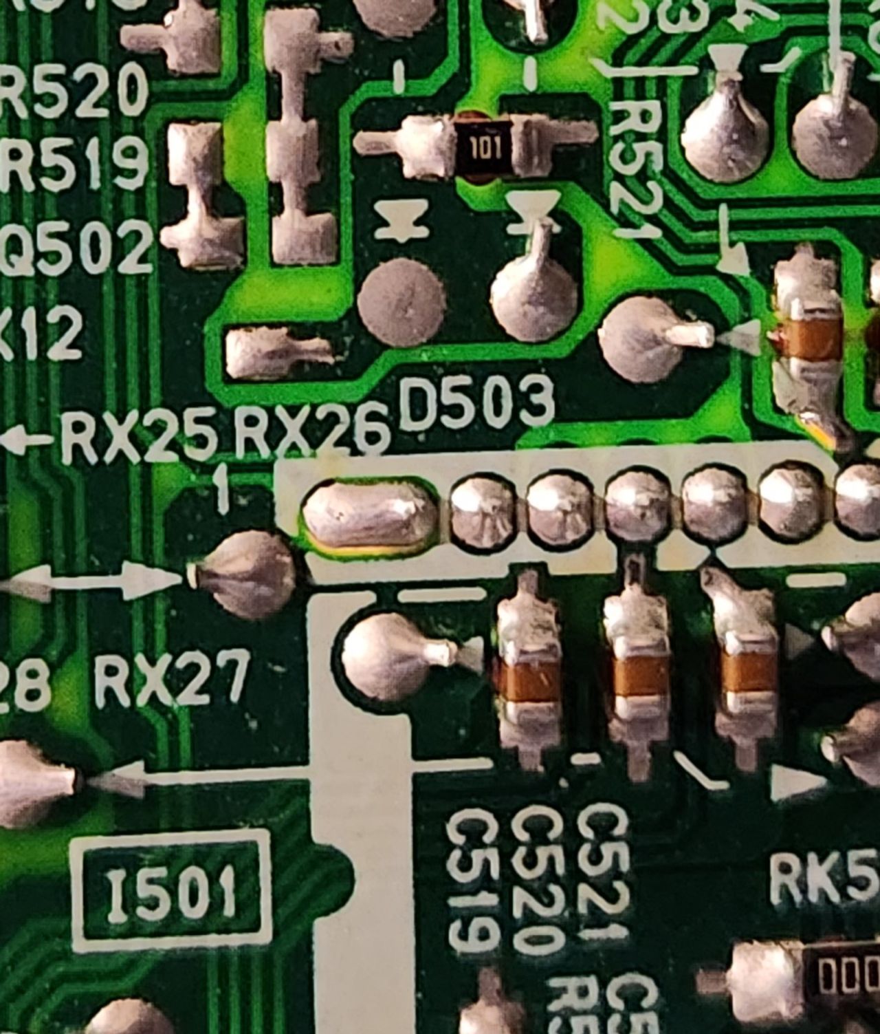 36UX01S - Close up of R521 and C519, C520, and C521. These components need to be removed to inject RGB into the PiP lines.