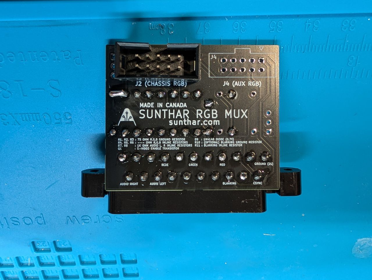 TV1334A - Back of mux board. Note the bridged audio pins. This is due to only having a single wire running to the mono audio on the chassis and was done as a work around because I cut the white wire. Proper procedure would be to connect both the gray and white cables to the board. 